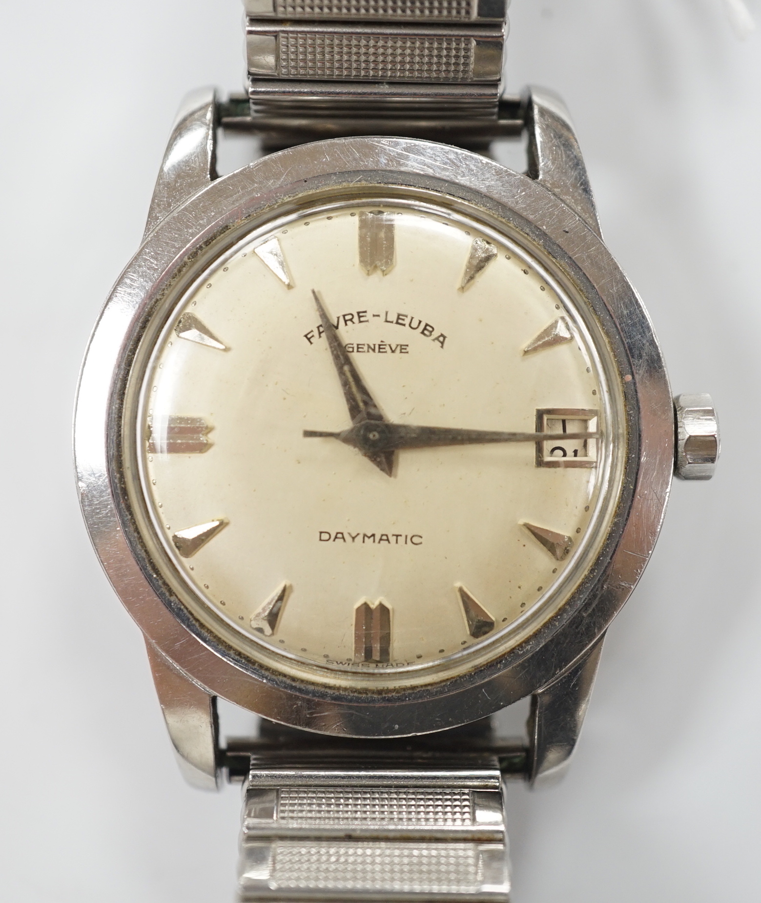 A gentleman's stainless steel Favre Leuba Daymatic manual wind wrist watch, on associated flexible strap.